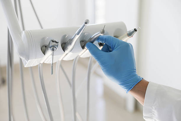 Professional Tooth Extraction technician working in Central, LA